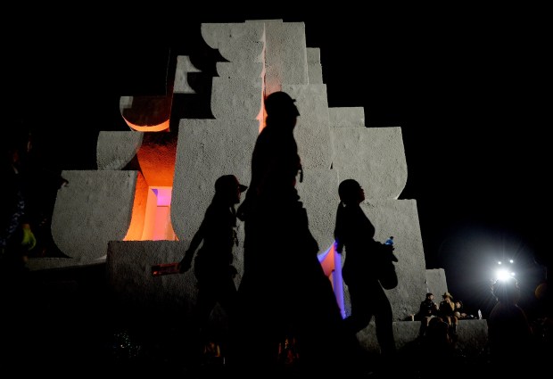 Festival goers move about the Babylon art installation, by Brando Posocco and Madhav Kidao, during the Coachella Valley Music and Arts Festival at the Empire Polo Club in Indio on Sunday, April 21, 2024. (Photo by Jennifer Cappuccio Maher, Contributing Photographer)