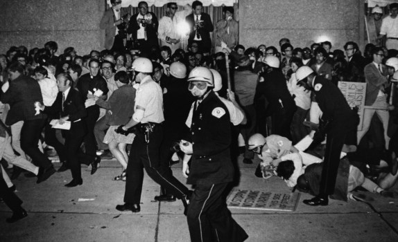 FILE – In this Aug. 29, 1968, file photo, Chicago Police attempt to disperse demonstrators outside the Conrad Hilton, the downtown headquarters for the Democratic National Convention in Chicago. During the convention, hundreds of demonstrators waged war with police and National Guardsmen on the streets of Chicago. (AP Photo/Michael Boyer, File)
