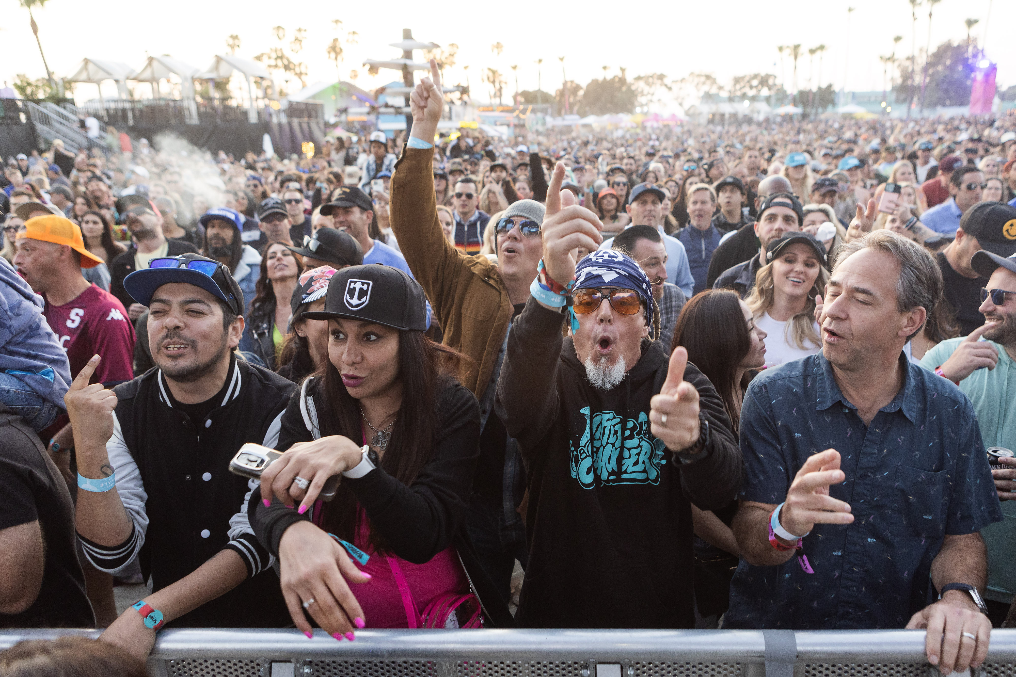 Fans of the Dirty Heads dance during their performance on...